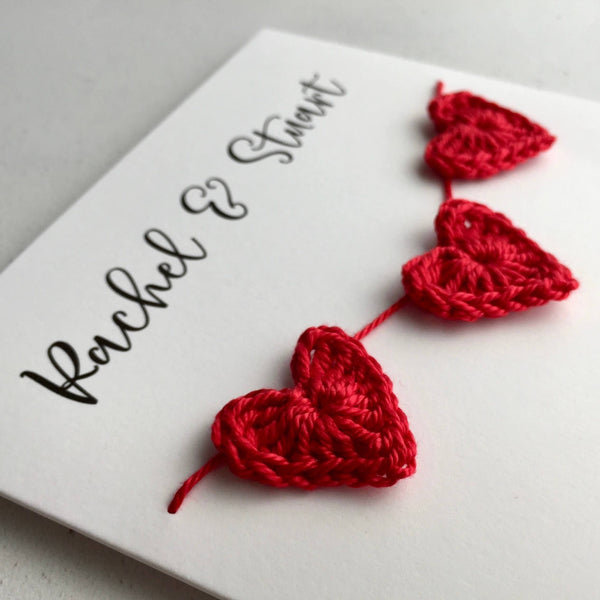 Engagement card finished with 3 crochet hearts